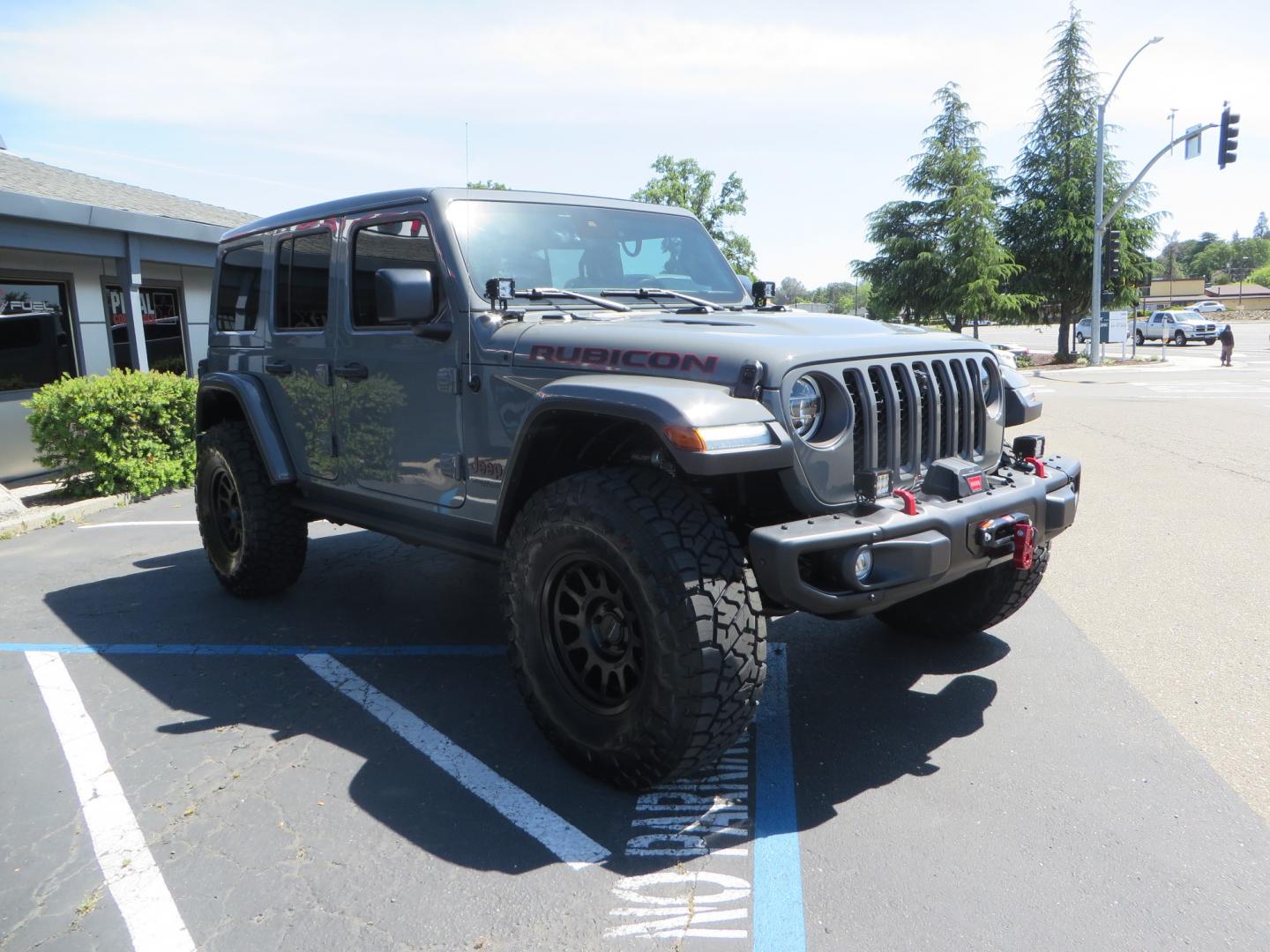 2021 Sting Grey /BLACK Jeep Wrangler Unlimited Rubicon (1C4JJXFM5MW) with an 3.0L V6 DOHC 24V TURBO DIESEL engine, 6A transmission, located at 2630 Grass Valley Highway, Auburn, CA, 95603, (530) 508-5100, 38.937893, -121.095482 - Diesel JL with Sky One power top featuring a Teraflex suspension system, Falcon adjustable shocks & steering stabilizer, Full Metal Cloak skid plate, 17" Method bead grip wheels, 37" Toyo RT Trail tires, Warn winch, Rigid Led lighting, Teraflex HD spare tire carrier, Teraflex Diff covers, Amp steps, - Photo#2